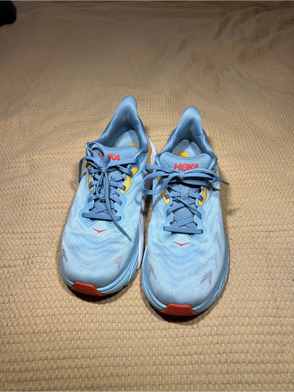 Hoka Men's Sky Blue Running Shoes with Yellow & Orange Accents